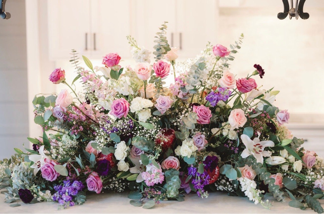 A large Flower Girl Studio arrangement of pink and white roses and eucalyptus