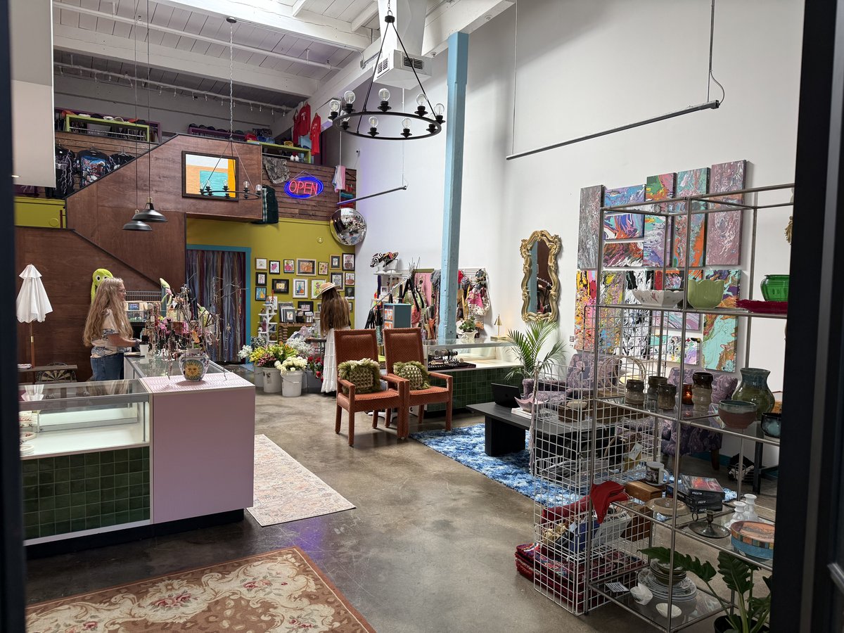 Inside White Clover, shelves and displays of gifts and vintage finds